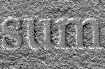 Popieriaus apatinis paviršius ant jo atspausdinus žodį „sum“